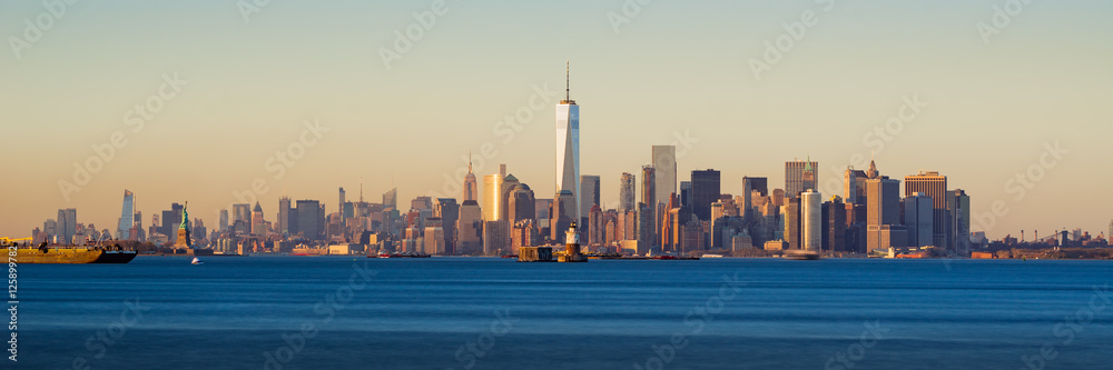 Panoramic Sunset of Lower Manhattan and New York City Harbor with Financial District skyscrapers