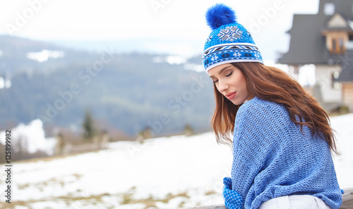 Amazing young woman in ski clothes outdoors