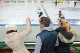 cheering a game of ice hockey