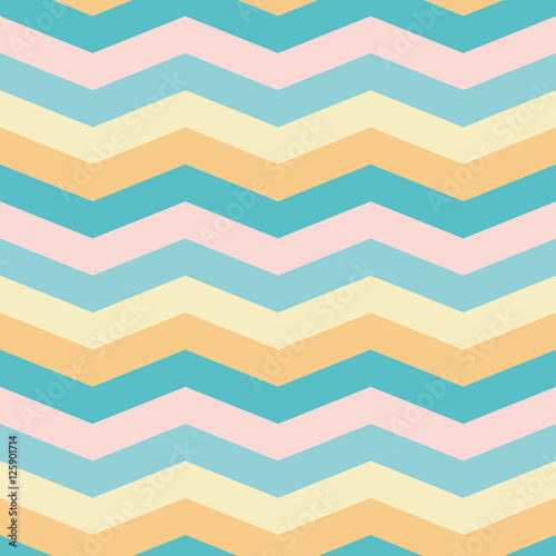 Seamless chevron pattern in pastel yellow, light & dark blue, pink & orange. Multi colored summer theme zigzag fabric print.