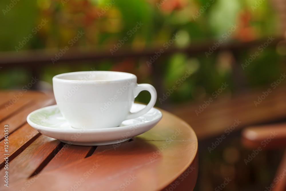 a cup of coffee and blurred bokeh background a cup of coffee and blurred bokeh background
