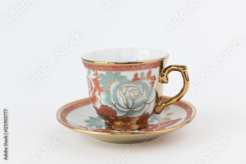 Porcelain tea cup on white background