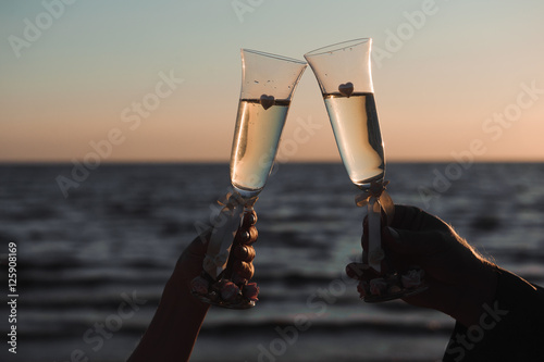 Glasses of champagne at the seaside - wedding ceremony decoratio