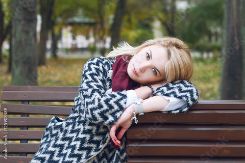 Cute smiling blond woman in autumn park © different_nata