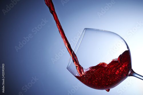 Pouring wine into glass 