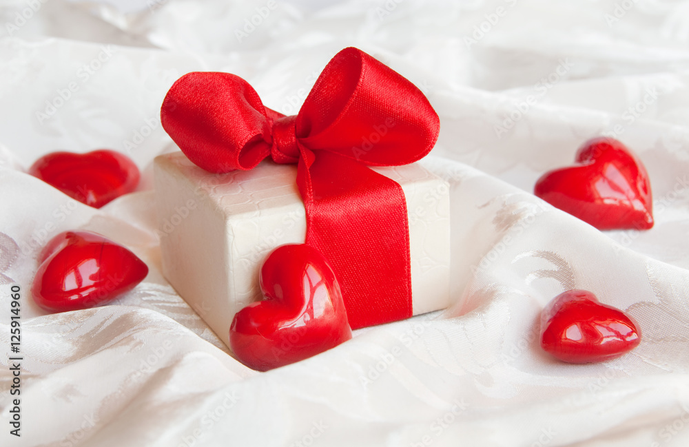 Gift box with red bow and hearts Gift box with red bow and hearts