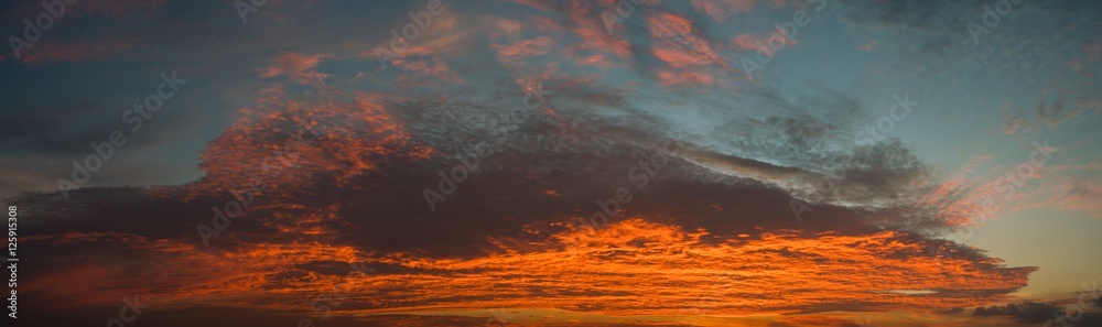 Fototapeta premium Panorama of a twilight sky Beauty Evening colorful clouds - sunlight with dramatic sky