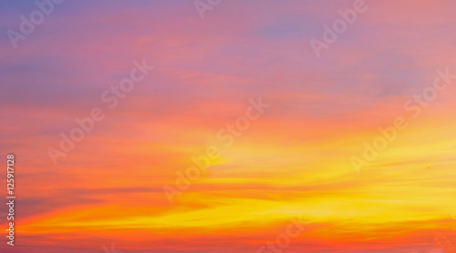 Bright orange and yellow colors dramatic sunset sky,sunrise sky,soft focus © chaipanya