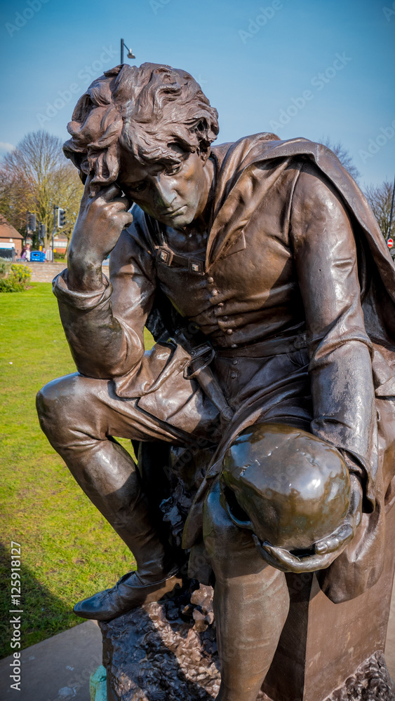 Bronze statue of Hamlet holding skull Bronze statue of Hamlet holding skull