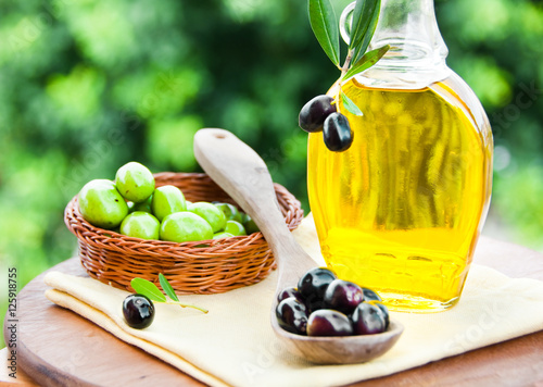 Olive oild and fresh olives photo