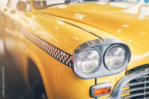 Close up headlight of yellow Retro classic car © Kittiphan