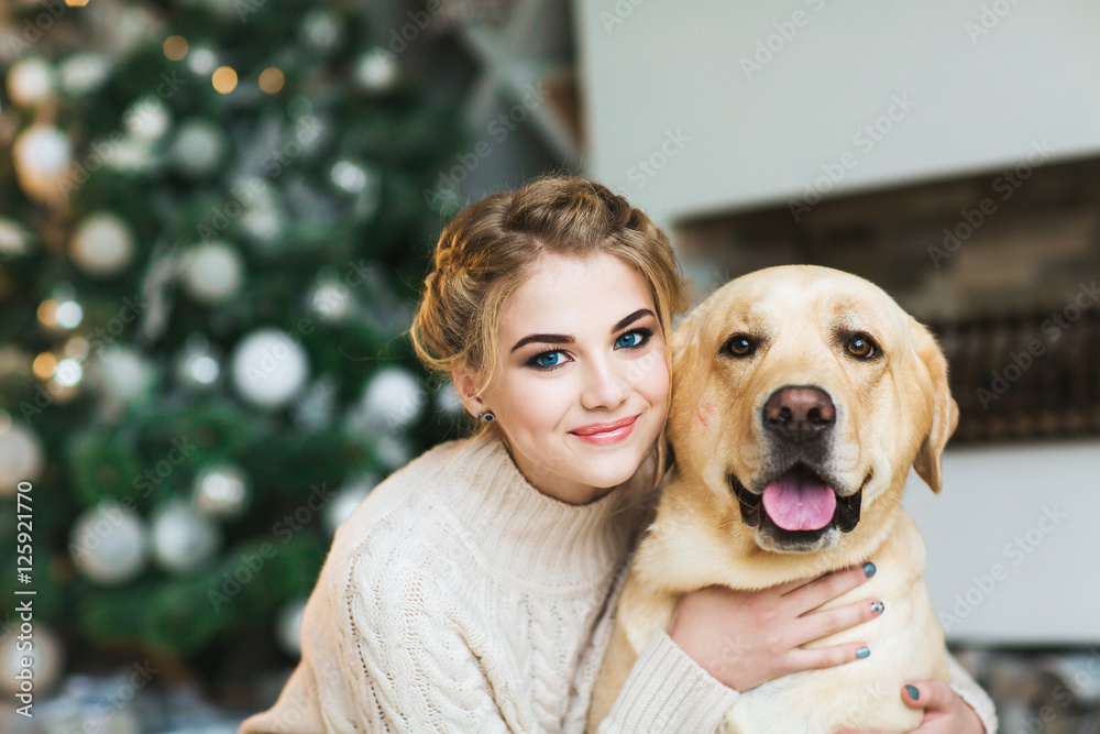 Beautiful teen girl with a labrador dog