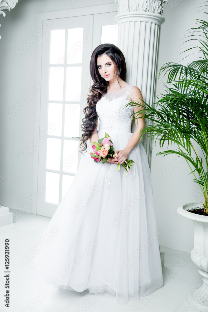 gorgeous bride in luxury wedding dress. Bride. Perfect Make up and Long Wavy Hair. Hairstyle, wedding jewelry. Beautiful Woman with Shiny Brown Hair. gorgeous wedding bouquet of various flowers. gorgeous bride in luxury wedding dress. Bride. Perfect Make up and Long Wavy Hair. Hairstyle, wedding jewelry. Beautiful Woman with Shiny Brown Hair. gorgeous wedding bouquet of various flowers.