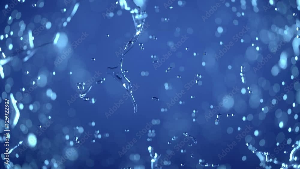 Water explosion ob blue background