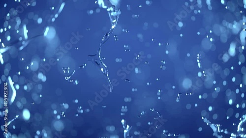 Water explosion ob blue background