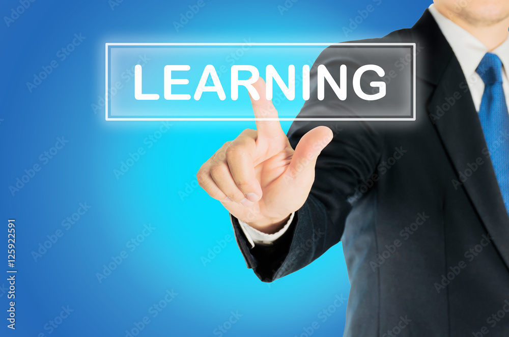Business man is pushing LEARNING transparent button word over blue gradient background, business concept Business man is pushing LEARNING transparent button word over blue gradient background, business concept