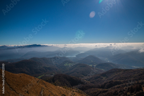 View from the summit of monte lema on the swiss and italian alps and the lake of lugano