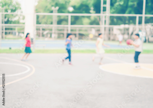 Blurred photo of Asian children are playing basketball
