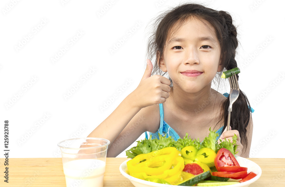 Asian lovely girl showing enjoy expression with fresh colorful vegetables and glass of milk isolated over white background