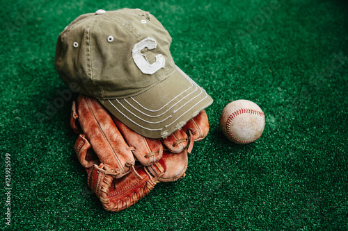 Photography baseball glove, baseball cap, ball.
