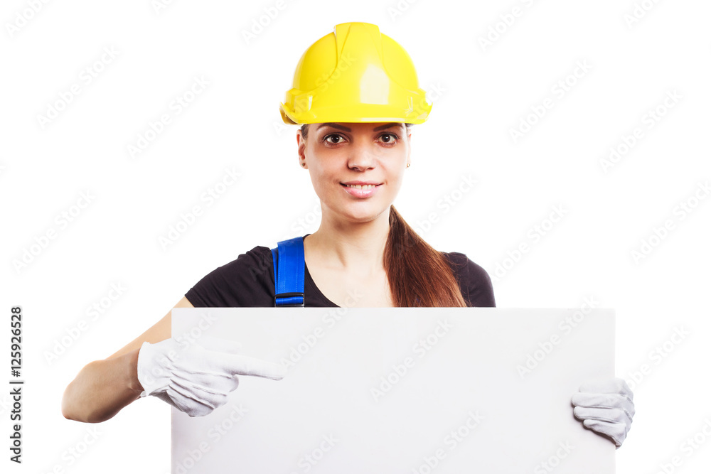 Woman builder in construction helmet with a placard Woman builder in construction helmet with a placard