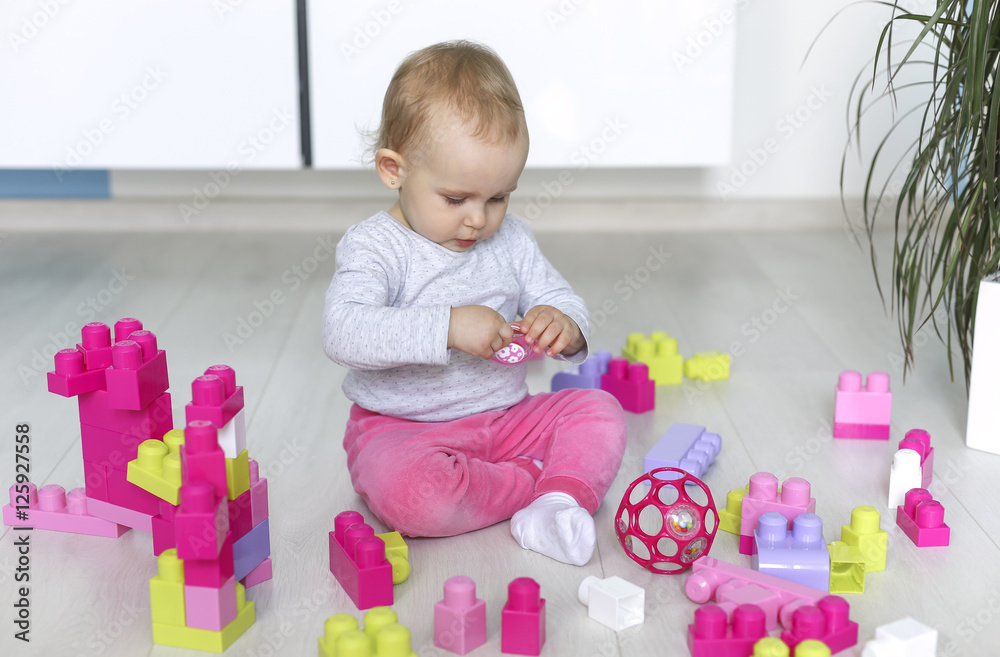 Preschooler child playing with colorful toy blocks Preschooler child playing with colorful toy blocks