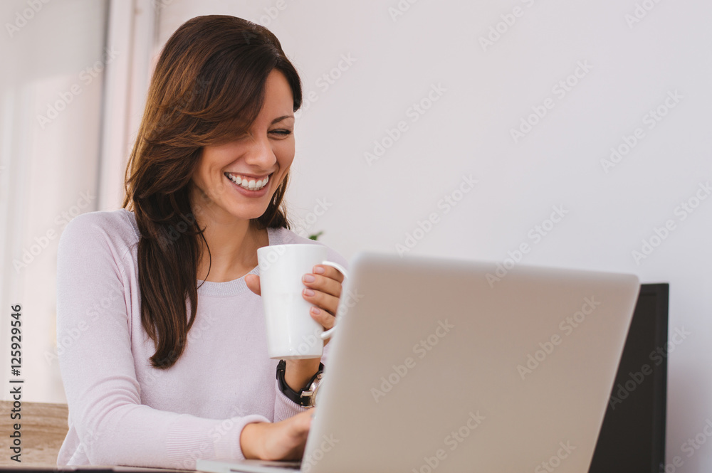 Beautiful woman working from her home office Beautiful woman working from her home office
