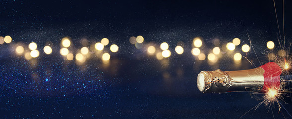 Abstract image of champagne bottle and festive lights