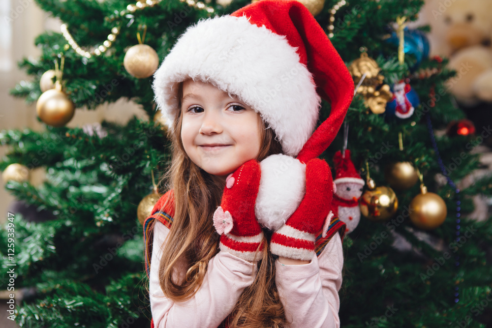 Beauty portrait of little girl in red hat