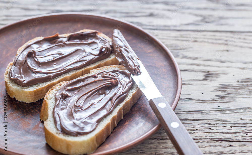 Fototapeta premium Slices of baguette with chocolate cream