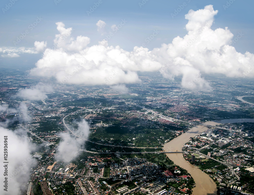 Ariel view of the city through the clouds