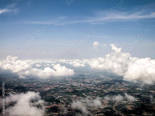Ariel view of the city through the clouds