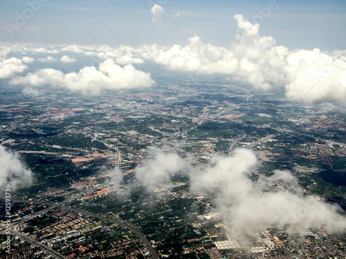 Ariel view of the city through the clouds