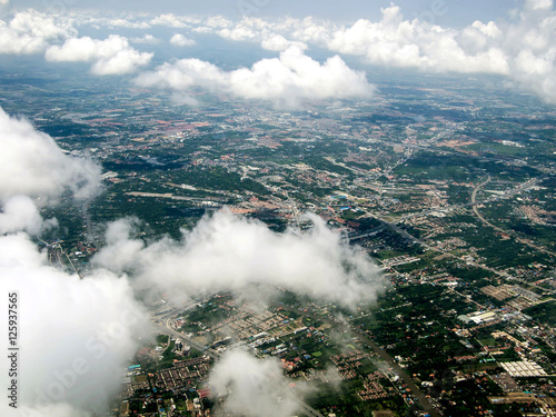 Ariel view of the city through the clouds