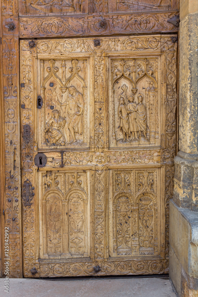 Detail of old wooden door carved