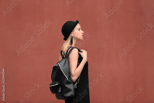 Stylish young woman in blac...