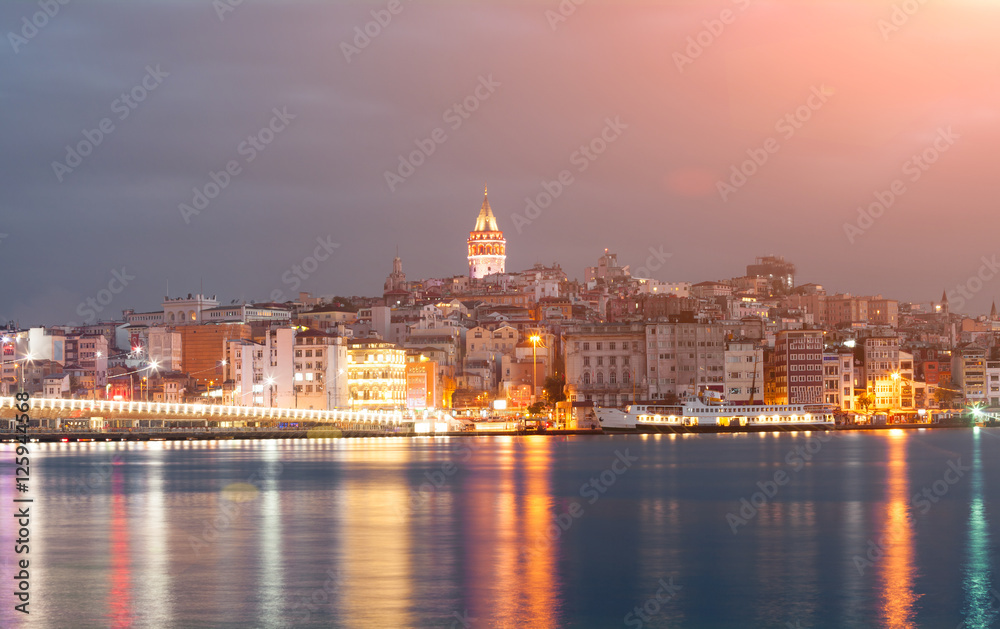 Nighte cityscape with Galata Tower over the Golden Horn in Istanbul, Turkey