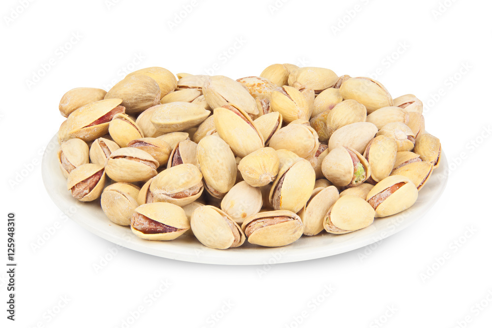 delicious pistachio nuts on plate on white background delicious pistachio nuts on plate on white background