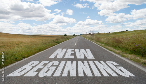 New beginning message written on the road