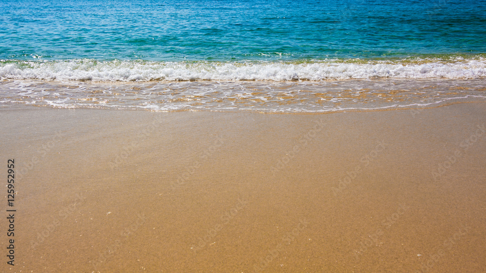 Blue Ocean Wave On Sandy Beach. Sand beach and tropical sea Blue Ocean Wave On Sandy Beach. Sand beach and tropical sea