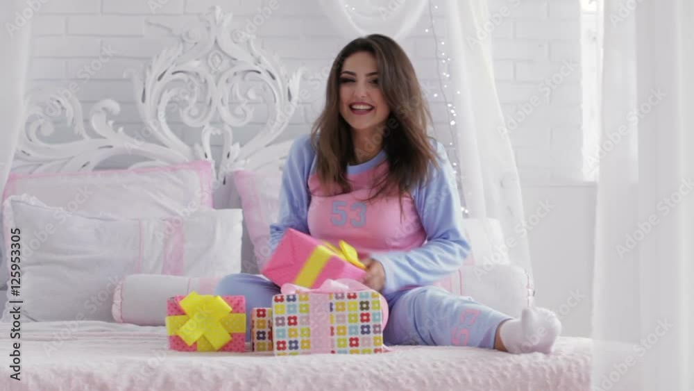 Pretty woman opening christmas presents Pretty woman opening christmas presents
