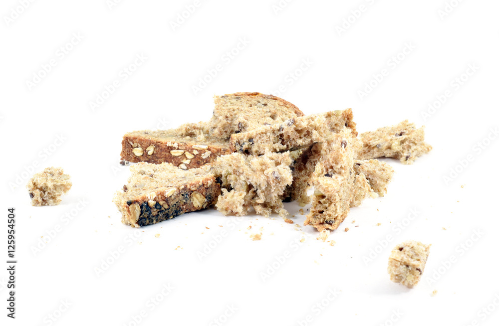 Crushed slice of multigrain whole wheat bread Crushed slice of multigrain whole wheat bread