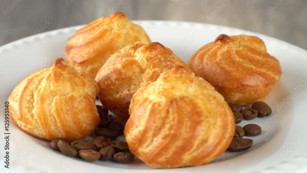 Delicious homemade pastry with coffee beans on a white plate. Seamless loopable. Prores 4K. Delicious homemade pastry with coffee beans on a white plate. Seamless loopable. Prores 4K.