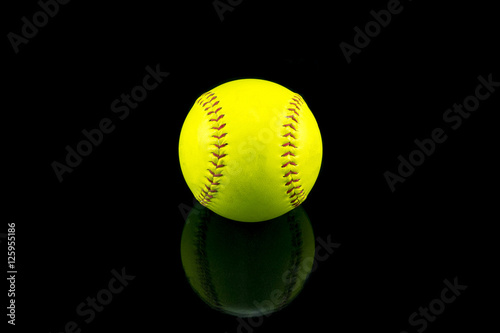 Baseball yellow on a black background .