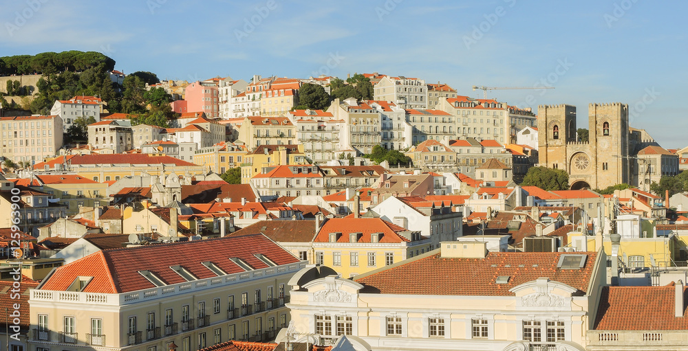 Lisbon, Portugal. Landscape from Triumphal arch to Saint George Castle and the city center at sunset.