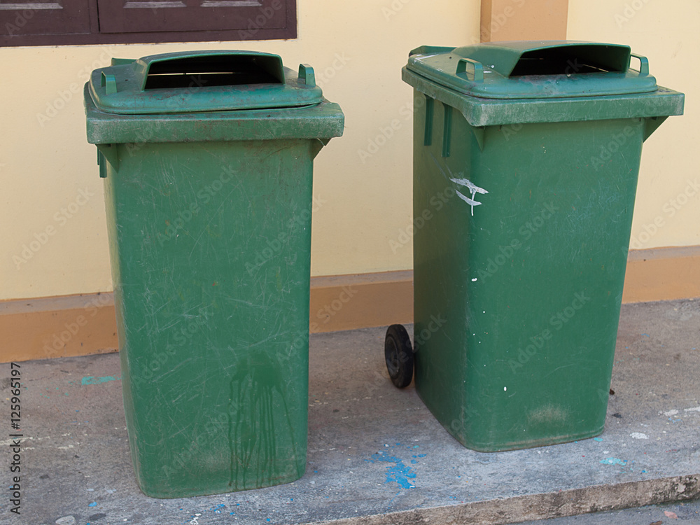 cedustbins outside ment wall.
