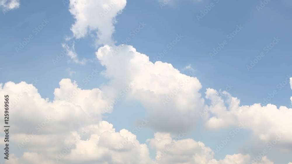 Fluffy white clouds on sky with a bright ,Slow-moving,Time Lapse.