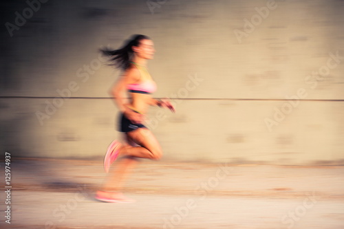 Speed concept - Woman running fast