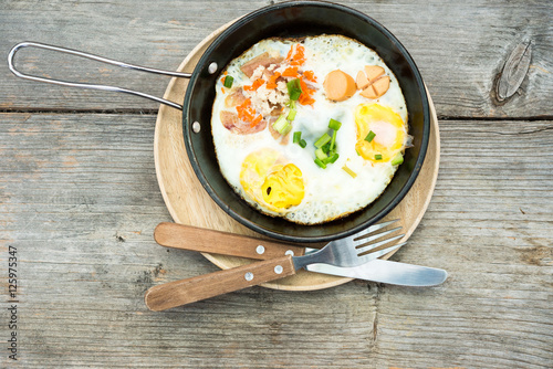 pan egg on wooden table, breakfast