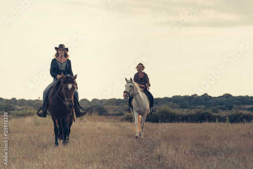 Girls Riding Horses in the Plains Mallorca © kltobias